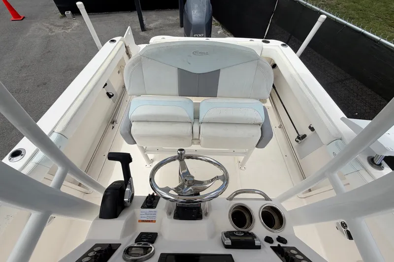 Slide: The Image of 2019 Robalo R222 Center Console boat interior with steering wheel and seating. - 54
