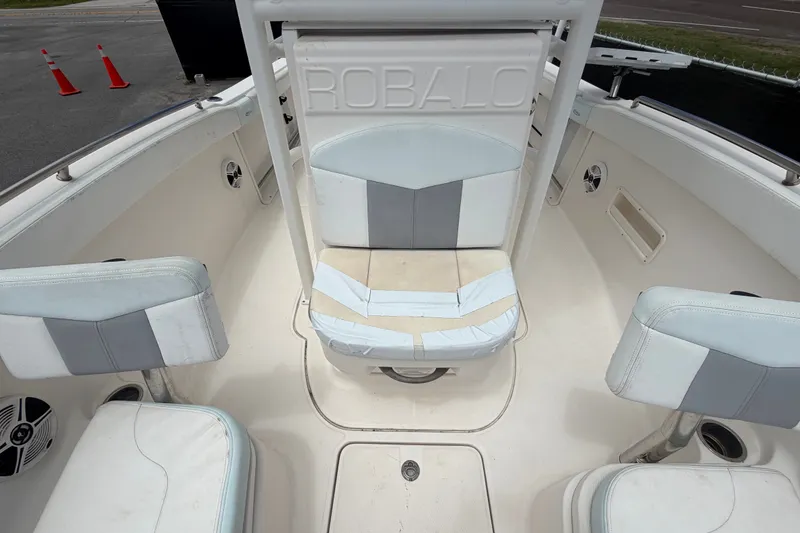 Slide: The Image of 2019 Robalo R222 Center Console boat interior with seating and storage. - 48
