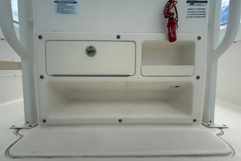 Slide: The Image of 2019 Robalo R222 Center Console storage compartments with safety features. - 29