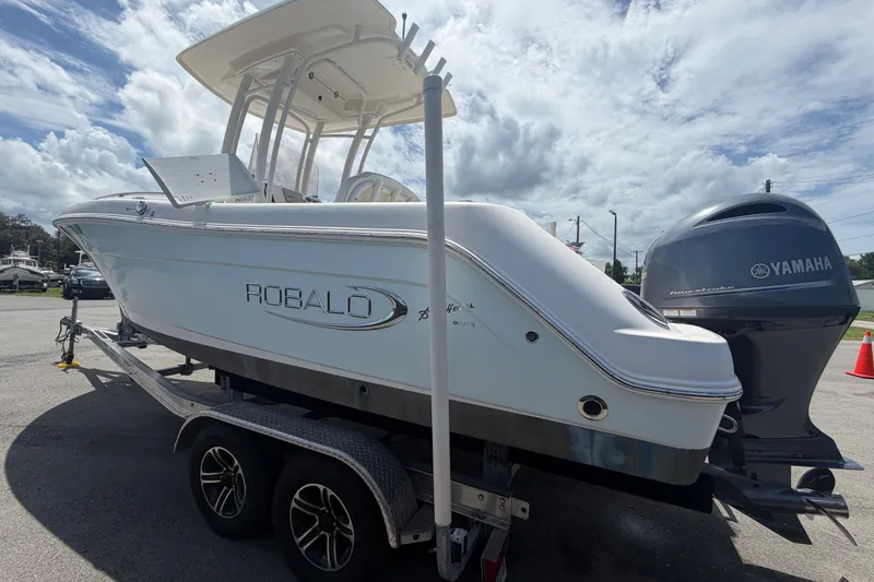 Slide: The Image of 2019 Robalo R222 Center Console boat on trailer with Yamaha engine. - 7