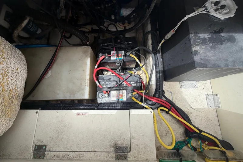 Slide: The Image of 2019 Robalo R222 Center Console boat battery compartment with wiring. - 62