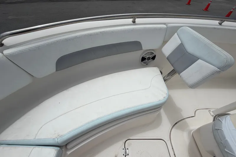 Slide: The Image of 2019 Robalo R222 Center Console boat seating area with cushioned seats and speaker. - 42