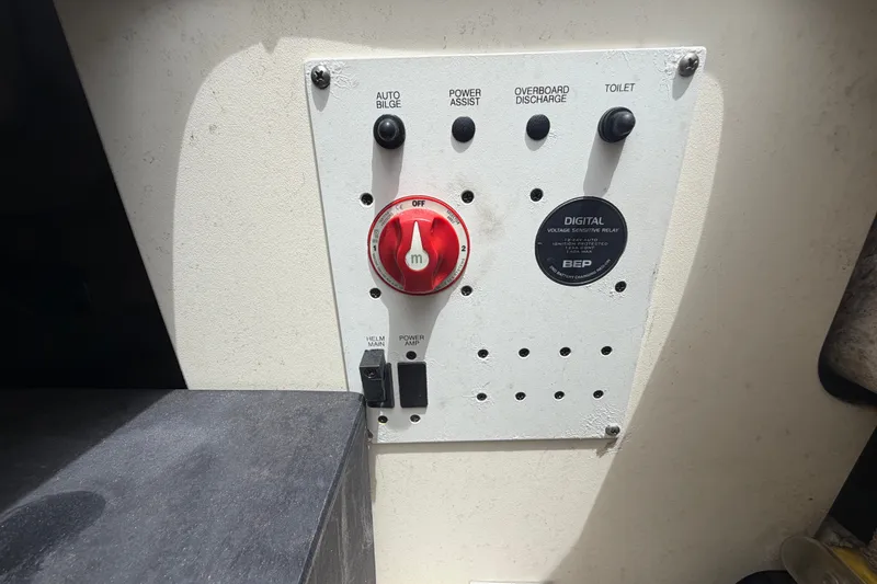 Slide: The Image of Control panel of a 2019 Robalo R222 Center Console boat with switches and dials. - 63