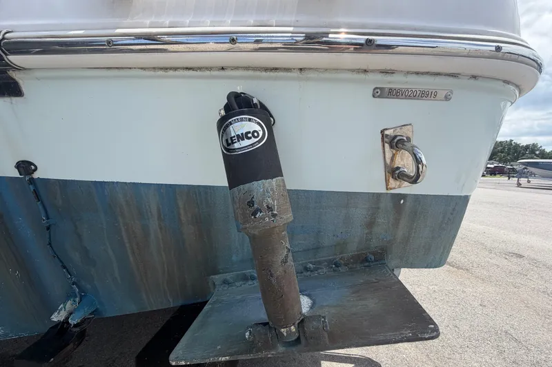 Slide: The Image of 2019 Robalo R222 Center Console boat with Lenco trim tab detail. - 5
