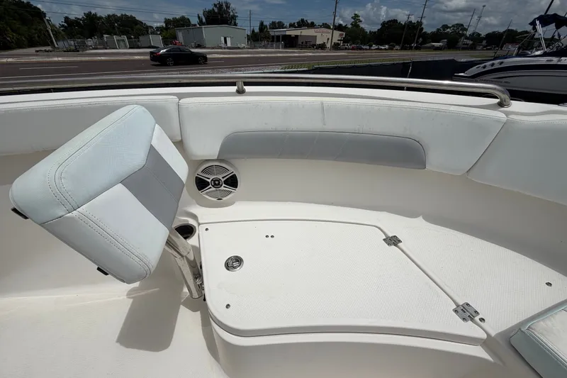 Slide: The Image of 2019 Robalo R222 Center Console boat interior with seating and speaker. - 37