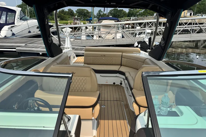 Slide: The Image of Interior view of a 2022 Sea Ray SLX 280 boat with luxurious seating and elegant design. - 17