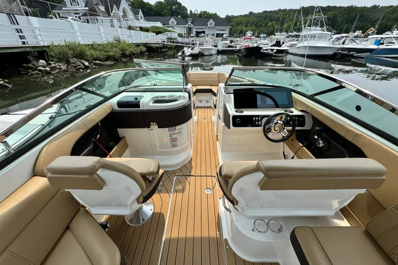 Slide: The Image of 2022 Sea Ray SLX 280 boat interior with luxurious seating and modern dashboard. - 8