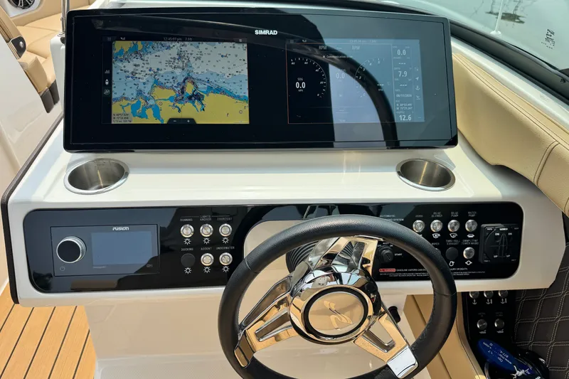 Slide: The Image of Dashboard of 2022 Sea Ray SLX 280 boat with navigation display and controls. - 10