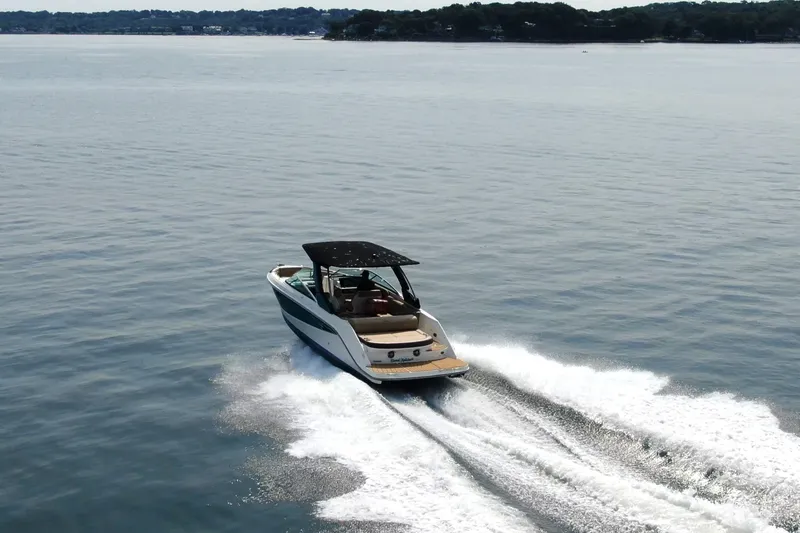 Slide: The Image of 2022 Sea Ray SLX 280 cruising on calm waters, showcasing sleek design and performance. - 1