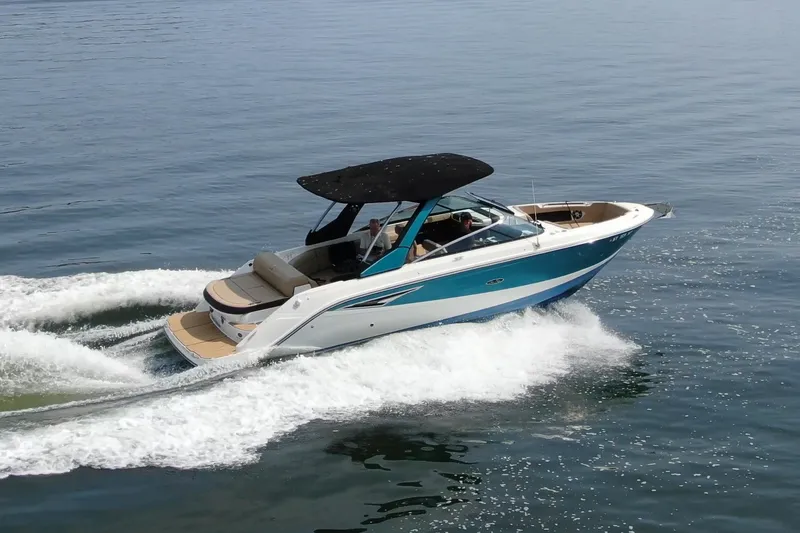 Slide: The Image of 2022 Sea Ray SLX 280 cruising on open water, showcasing sleek design and performance. - 0