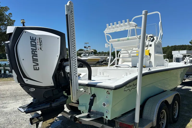 Slide: The Image of 2016 Shallow Sport 24 Modified V boat with Evinrude E-TEC engine on trailer. - 14