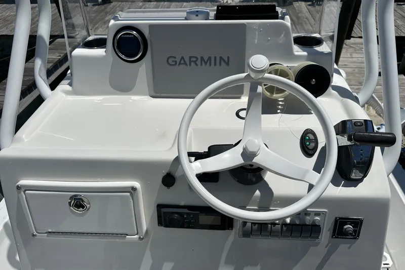 Slide: The Image of Control panel of a 2016 Shallow Sport 24 Modified V boat with Garmin navigation. - 26