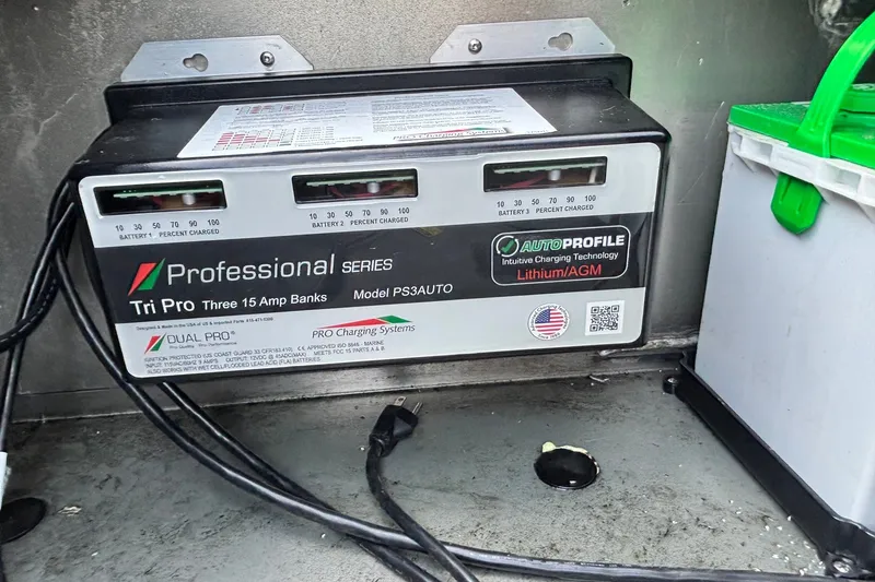 Slide: The Image of Battery charger in a Ranger RT198P 2025 boat, featuring Tri Pro 15 Amp banks. - 11