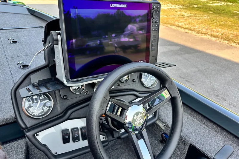 Slide: The Image of 2025 Ranger RT198P boat dashboard with Lowrance display and steering wheel. - 6