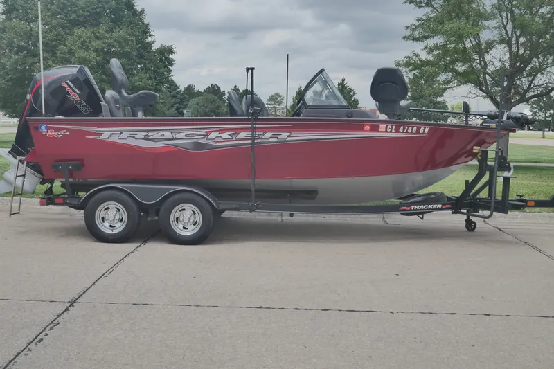The Image of 2023 Tracker Targa V-19 Combo boat on trailer, parked outdoors. - 0
