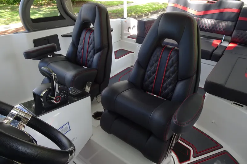 Slide: The Image of Luxurious interior of 2025 Monterey Elite 27 OB boat with plush seating. - 17