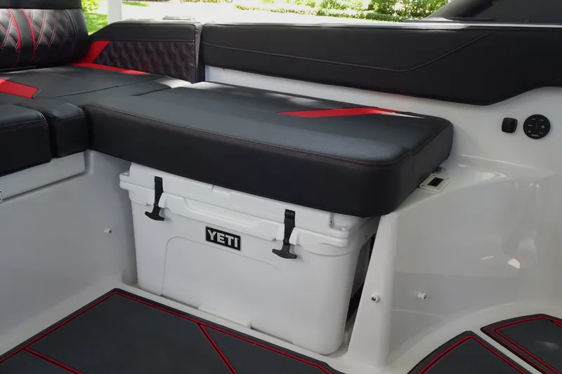 Slide: The Image of Interior of 2025 Monterey Elite 27 OB boat with Yeti cooler storage. - 16