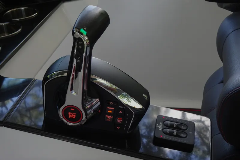 Slide: The Image of Throttle control panel of 2025 Monterey Elite 27 OB boat, featuring start/stop button. - 21