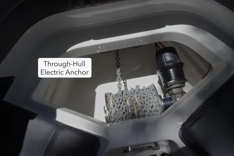 Slide: The Image of 2025 Monterey Elite 27 OB through-hull electric anchor system, showcasing chain and mechanism. - 30
