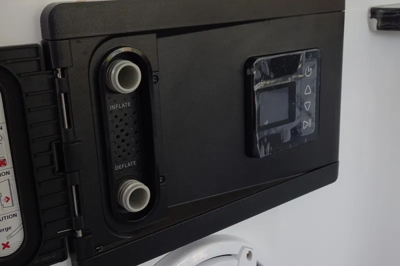 Slide: The Image of Control panel on 2025 Monterey Elite 27 OB boat, featuring inflate and deflate options. - 22