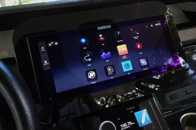 Slide: The Image of Simrad touchscreen display on 2025 Monterey Elite 27 OB boat dashboard. - 20