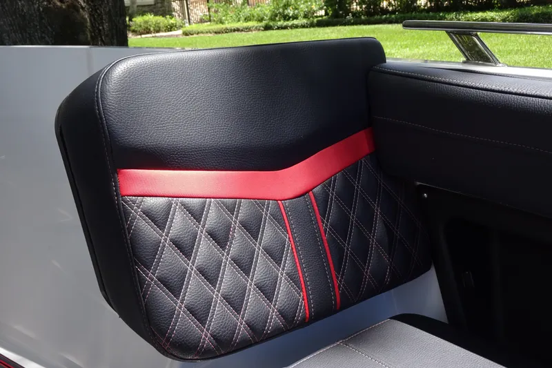Slide: The Image of Luxurious black and red quilted seat detail in 2025 Monterey Elite 27 OB boat. - 25