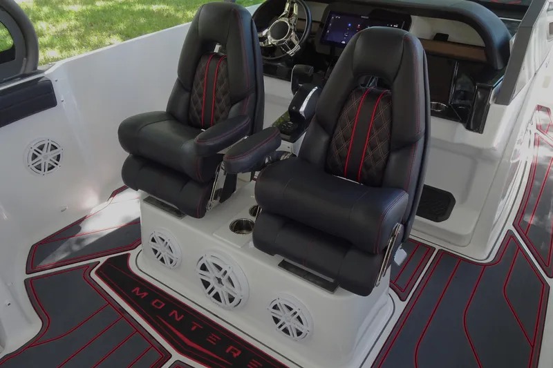 Slide: The Image of Luxury seating in 2025 Monterey Elite 27 OB boat with modern dashboard and stylish interior. - 19