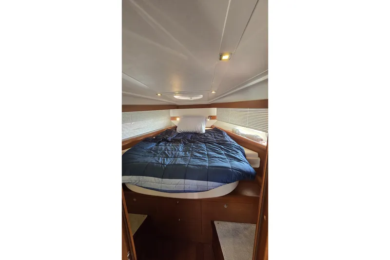 Slide: The Image of Cozy cabin interior of 2013 Beneteau Gran Turismo 38 yacht with a comfortable bed. - 27