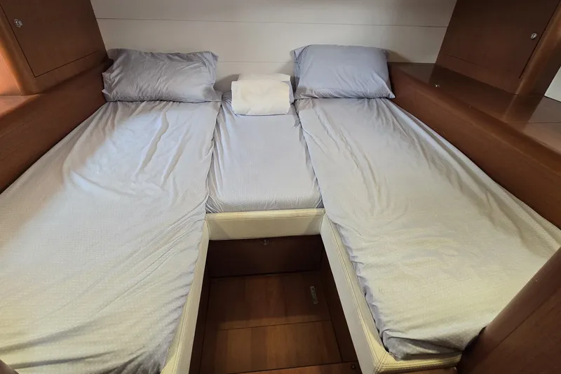Slide: The Image of Cabin interior of 2013 Beneteau Gran Turismo 38 with twin beds and wooden finish. - 30