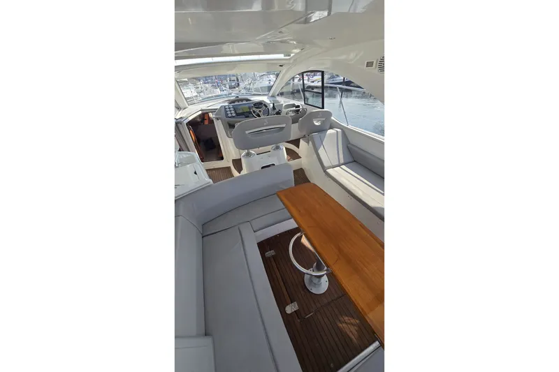 Slide: The Image of Interior of 2013 Beneteau Gran Turismo 38 yacht with helm and seating area. - 13