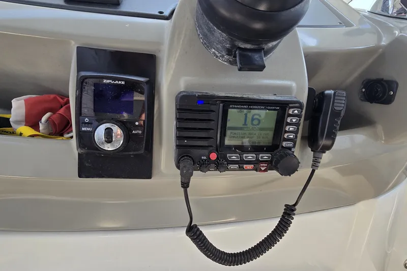 Slide: The Image of Control panel of a 2013 Beneteau Gran Turismo 38 with radio and navigation equipment. - 16