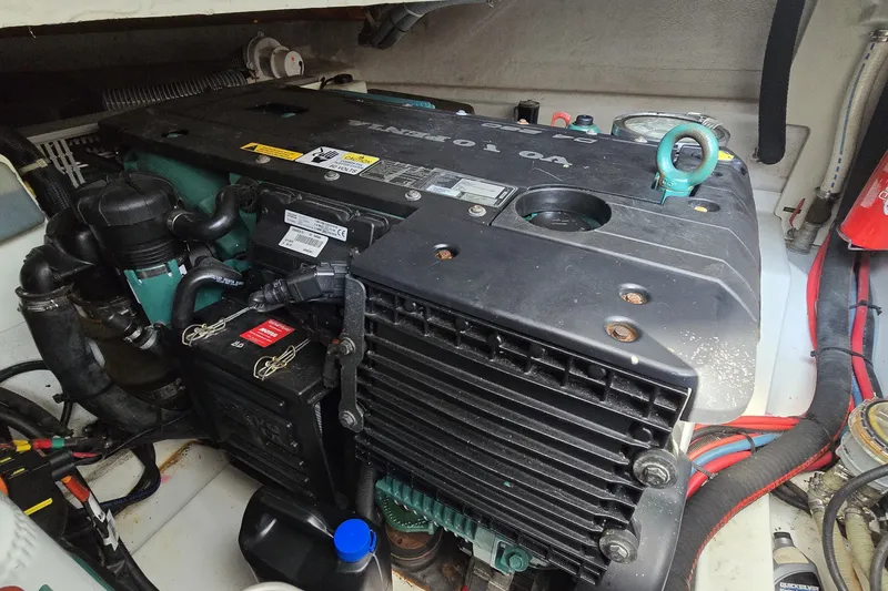 Slide: The Image of Engine compartment of a 2013 Beneteau Gran Turismo 38 boat, featuring a Volvo Penta engine. - 42
