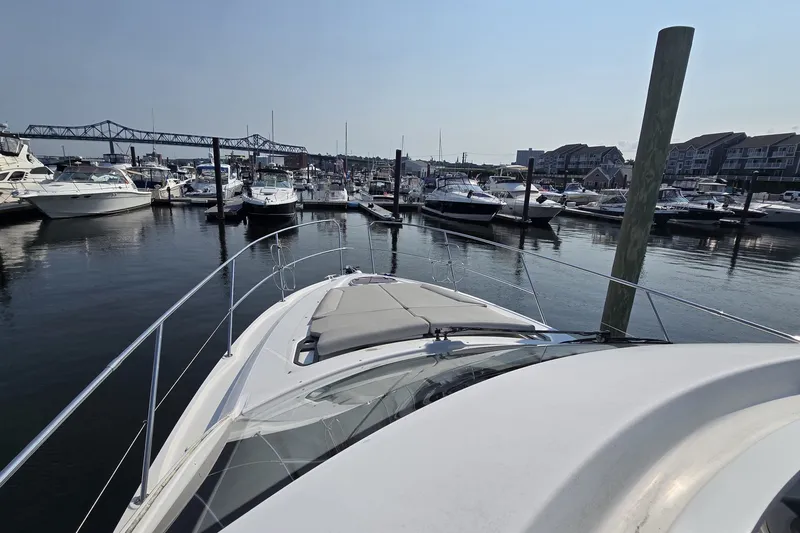 Slide: The Image of 2013 Beneteau Gran Turismo 38 yacht docked in a marina with other boats. - 35
