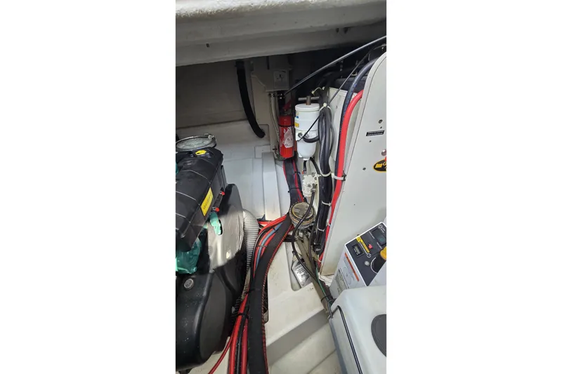 Slide: The Image of Engine compartment of 2013 Beneteau Gran Turismo 38 with visible wiring and components. - 41