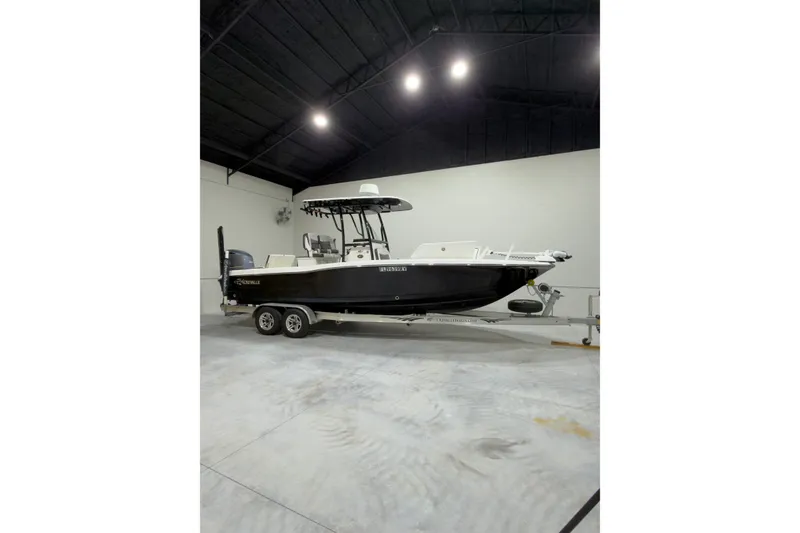 The Image of 2019 Crevalle 26 Bay boat on trailer in indoor storage facility. - 0