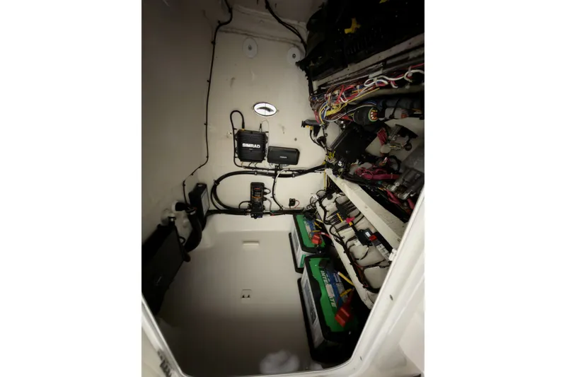 Slide: The Image of 2019 Crevalle 26 Bay boat interior wiring and battery setup with Simrad electronics. - 17