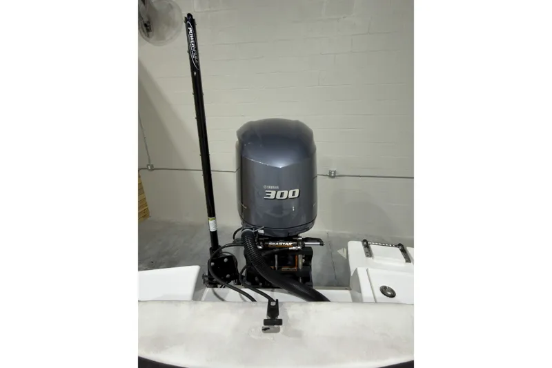 Slide: The Image of 2019 Crevalle 26 Bay boat with Yamaha 300 outboard motor in a garage. - 3