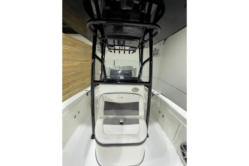 Slide: The Image of 2019 Crevalle 26 Bay boat interior with seating and console, showcasing sleek design. - 1