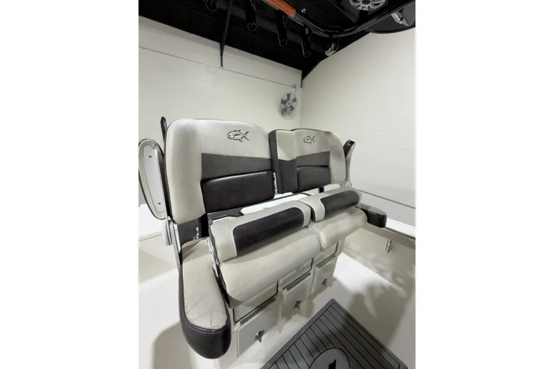 Slide: The Image of 2019 Crevalle 26 Bay boat seating with black and white cushioned design. - 5
