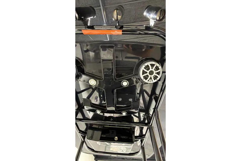 Slide: The Image of 2019 Crevalle 26 Bay boat console with speakers and controls. - 12