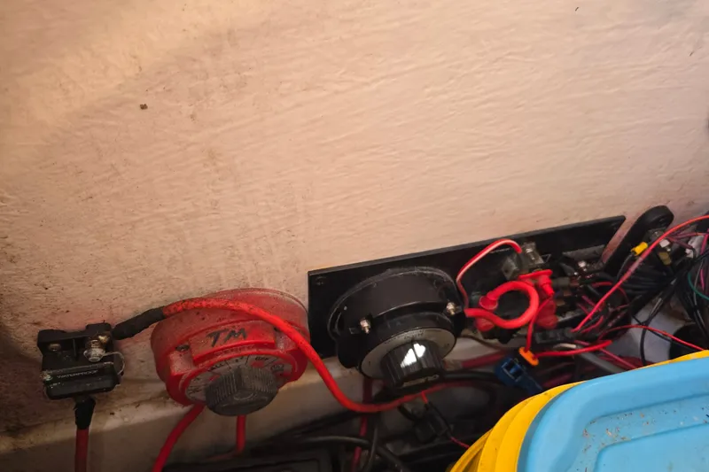 Slide: The Image of Electrical wiring and switches inside a 2008 Triton 240 LTS Pro boat. - 29