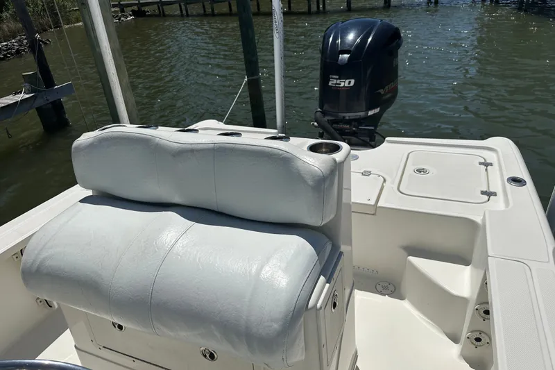 Slide: The Image of 2008 Triton 240 LTS Pro boat interior with seating and Yamaha 250 outboard motor. - 25