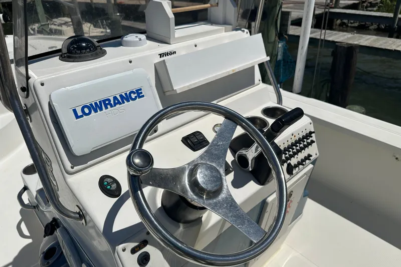 Slide: The Image of 2008 Triton 240 LTS Pro boat console with steering wheel and Lowrance HDS system. - 19
