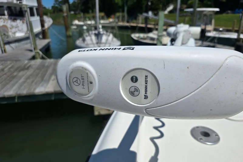 Slide: The Image of Minn Kota i-Pilot trolling motor on 2008 Triton 240 LTS Pro boat at dock. - 21
