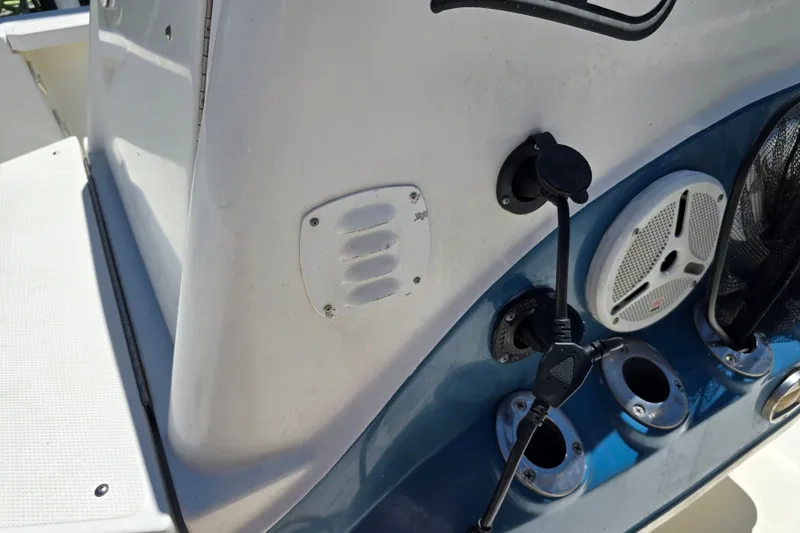 Slide: The Image of 2008 Triton 240 LTS Pro boat console with speaker and control panel. - 30