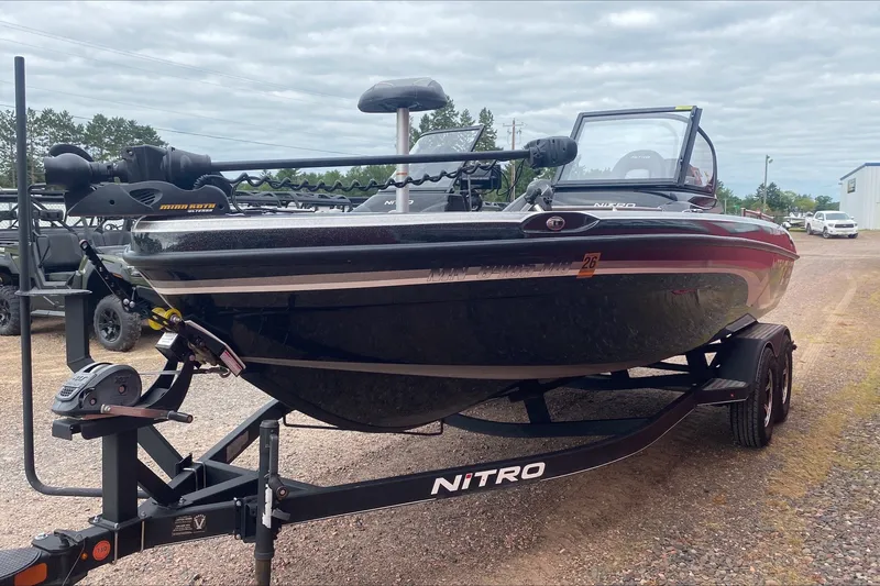 Slide: The Image of 2019 Nitro ZV19 Pro fishing boat on trailer, parked outdoors. - 3