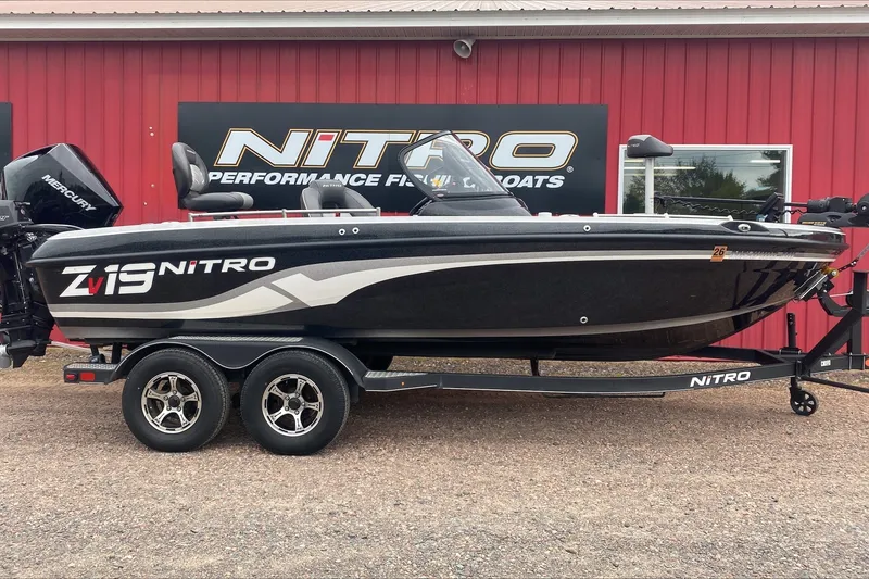 The Image of 2019 Nitro ZV19 Pro fishing boat on trailer, displayed outside dealership. - 0