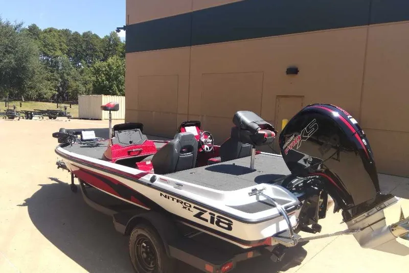 Slide: The Image of 2027 Nitro Z18 XL Pro boat with powerful engine, parked outdoors. - 8