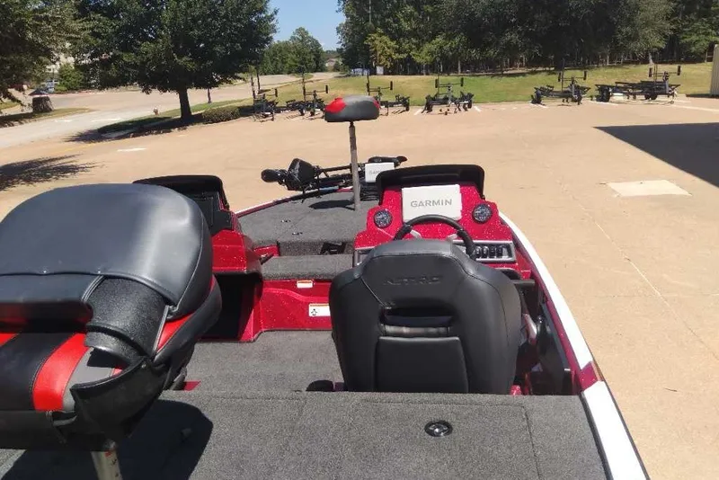 Slide: The Image of 2027 Nitro Z18 XL Pro boat interior with Garmin navigation system, parked outdoors. - 10