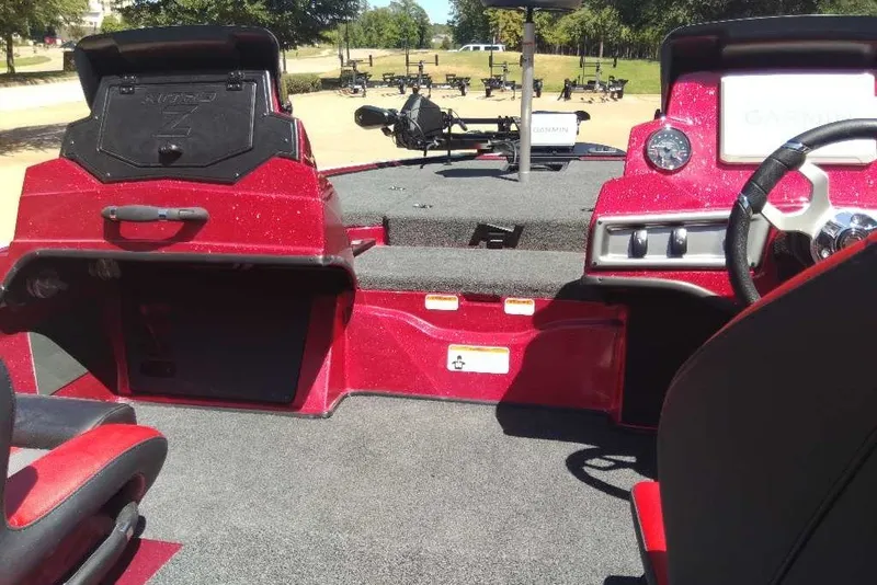 Slide: The Image of Interior of a 2027 Nitro Z18 XL Pro boat with red accents and modern controls. - 12